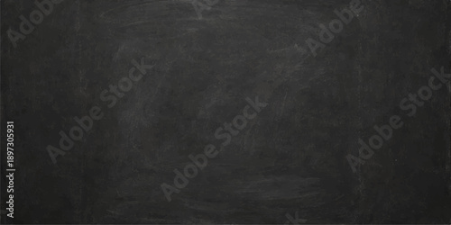 A vintage dark grunge blackboard with a rough textured surface and blank chalkboard pattern on an old black wall backdrop