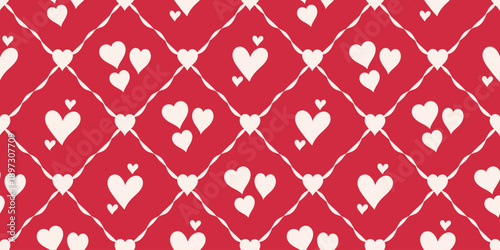 Romantic seamless pattern featuring soft cream hearts arranged in a diamond lattice over a bold red background
