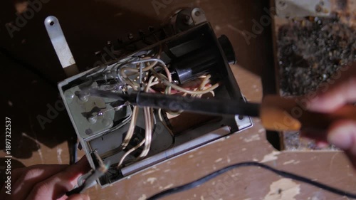 repair of a microcircuit with a soldering iron and a tweezers close-up