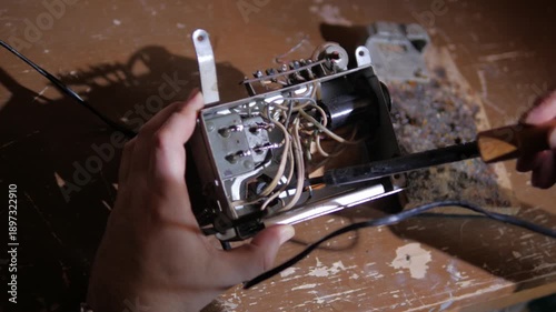 repair of capacitors on an old microcircuit using a soldering iron