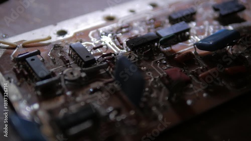 soldering a capacitor on a microcircuit radio equipment repair close-up