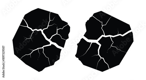 Cracked earth formations with distinct white lines a dramatic silhouette