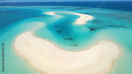 Serene turquoise waters surround a pristine white sandbar, a tranquil tropical paradise from above.