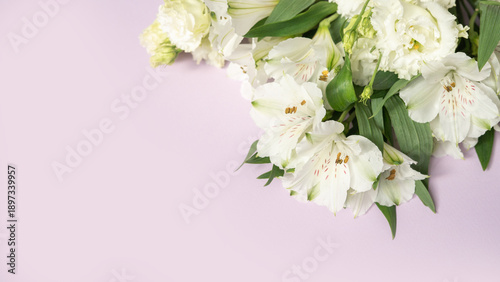 Elegant white lily bouquet on soft pink background