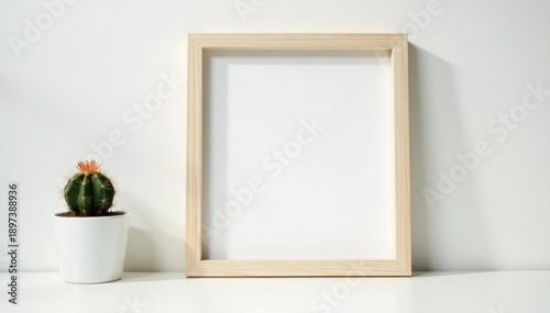 Empty frame mockup, white desk, small cactus, bright backdrop, scene, succulent