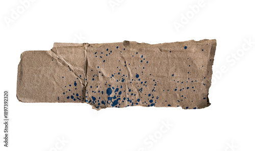 Photos Papel kraft rasgado con salpicaduras de pintura azul sobre fondo negro