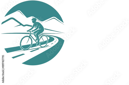 Silhouette of a cyclist on a winding road with mountains in the background