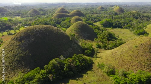 Chocolate Hills - one of the main attractions of the island of Bohol. Summer landscape in the Philippines.