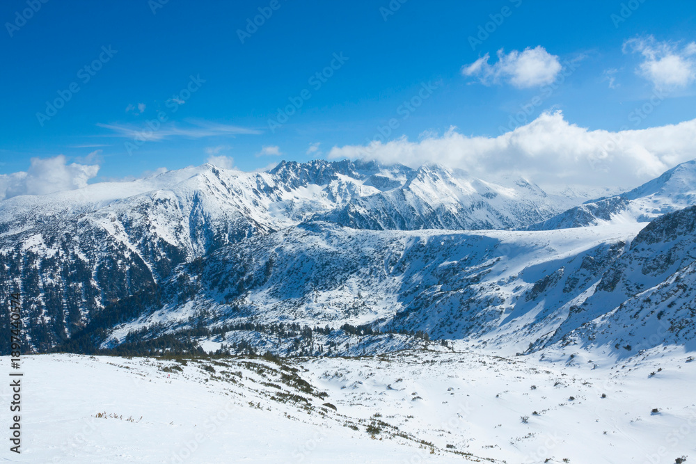 Obraz premium View on top of Pirin mountains from cable car, ski resort Bansko, Bulgaria.