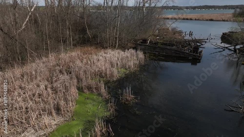Abandoned iron works and wooden docks on Cayuga Lake in central New York State within the Montezuma wildlife preserve