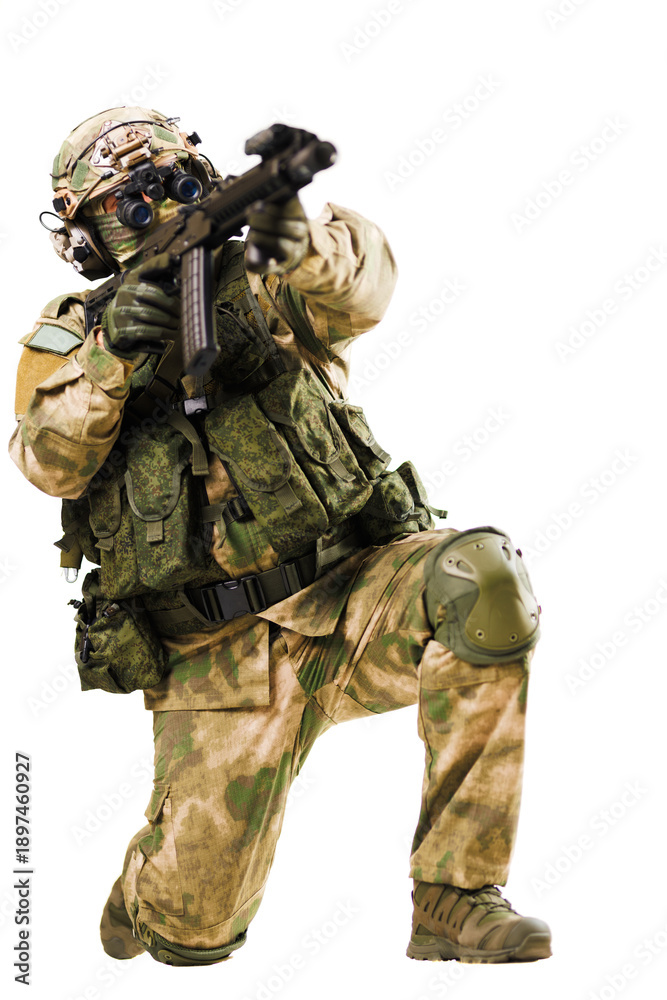 Fototapeta premium Military soldier kneeling and aiming weapon in tactical combat gear