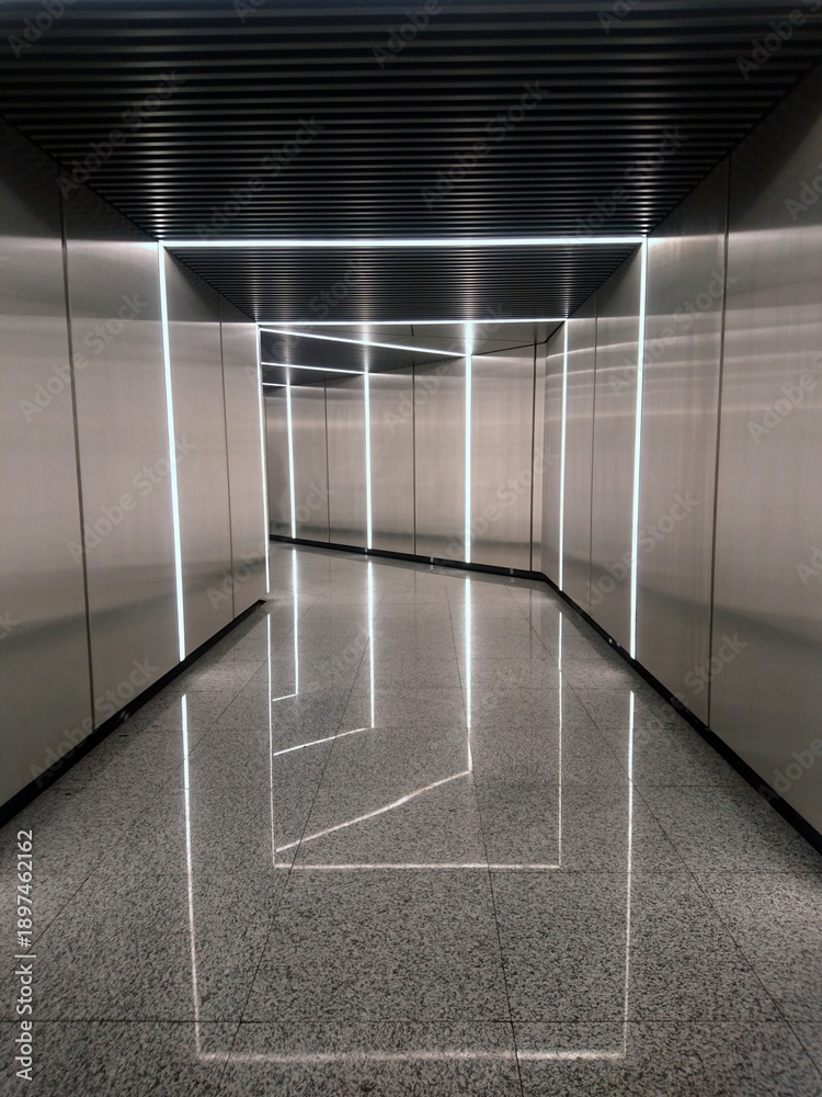 Obraz premium Futuristic corridor with LED light frames and reflective floor