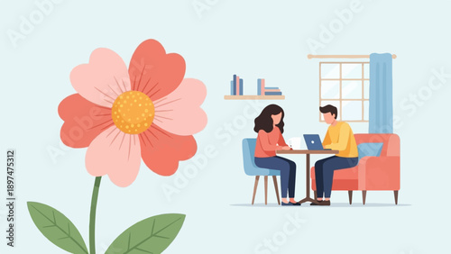 Two people work on laptops in a room with a large flower nearby