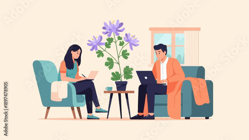 Two people working on laptops, seated in armchairs with a plant nearby