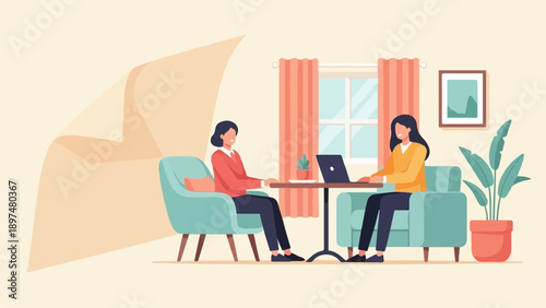 Two women in armchairs at a table with a laptop and plant