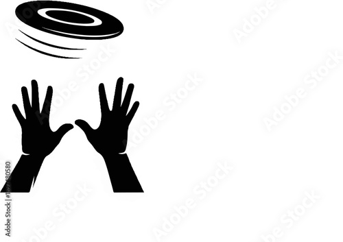 Hands reaching up to catch a spinning disc in motion