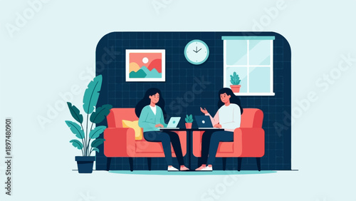 Two women on couch using laptops in a room with plant, art, clock, window
