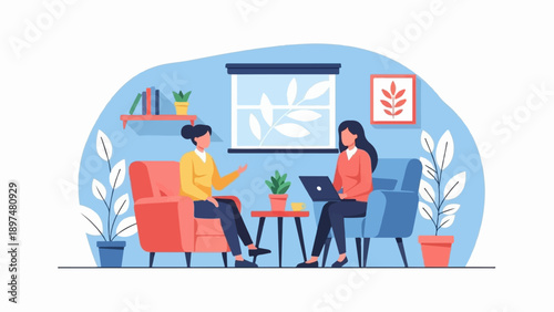 Two women converse while one works on a laptop in a cozy room