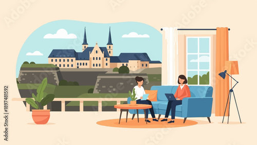 Two women working on laptops in a cozy living room with a castle view