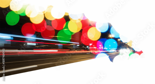 Abstract city lights create a blur of color and motion on a dark, wet road