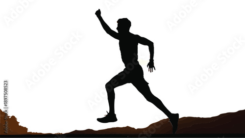 Silhouette of a man running and jumping over a rocky terrain