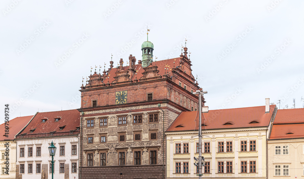 Obraz premium Large square old red brick building And a few houses on the edges in the city of Pilsen in the Czech Republic