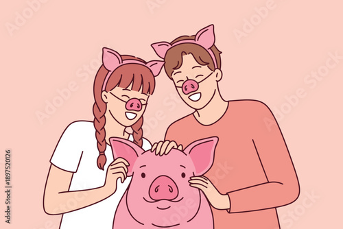 Young man and woman posing with their pet pig while wearing funny snout masks. Playful celebration of animals and humor during festive event at home or outdoors with domestic swine.