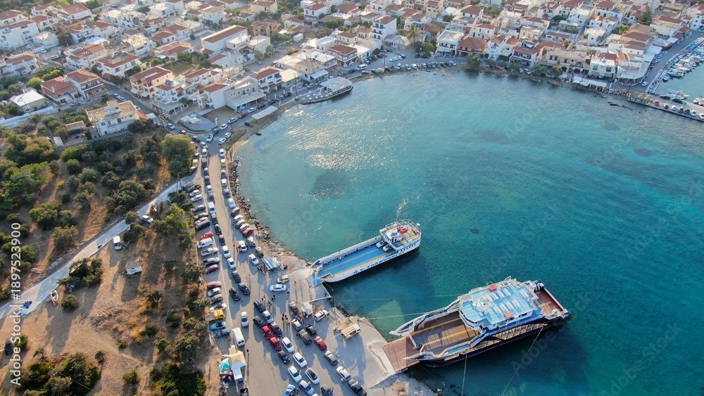 Fototapeta premium Aerial view of Elafonisos port with ferry boats and turquoise waters, Peloponnese, Greece