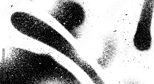 Abstract black spray paint splatters on a white background.