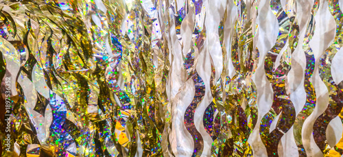 golden garlands on the wall, curtain made of garlands