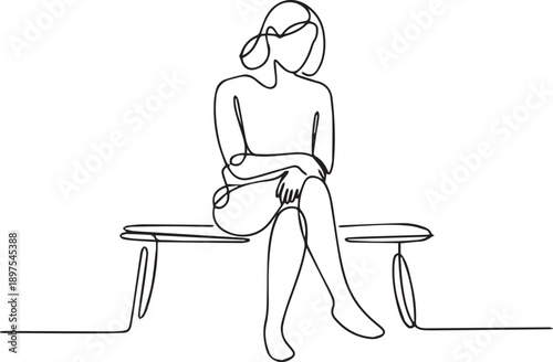 Woman sitting alone on a bench in a serene environment from a front viewpoint