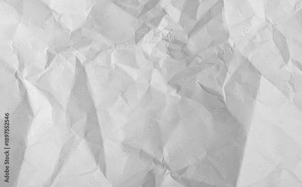 Fototapeta premium Old crumpled paper sheet with torn edges and weathered texture. Blank white background ideal effect.