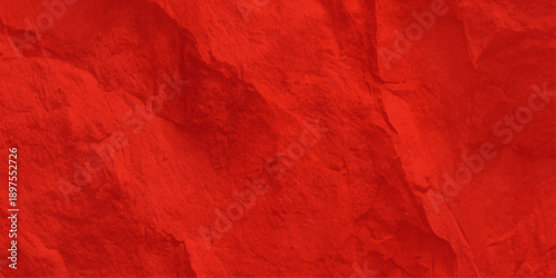Grungy red paint texture with a crumpled paper design and silk textile pattern creates an old art backdrop for a Valentine or Christmas wall surface