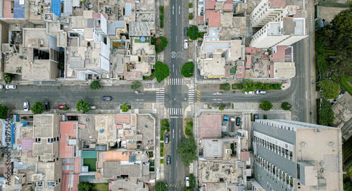Bird’s eye view of residential neighborhood streets and road markings.