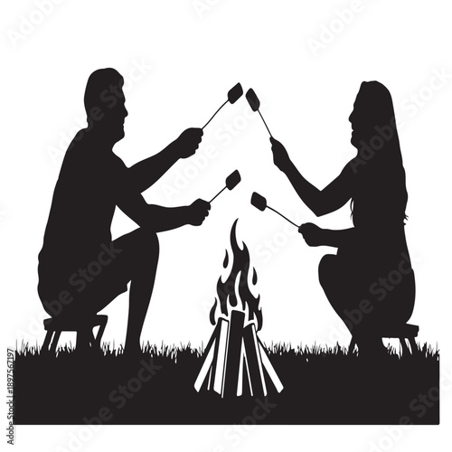 Silhouette couple sitting by campfire roasting marshmallows on sticks enjoying relaxing evening outdoors camping activity together