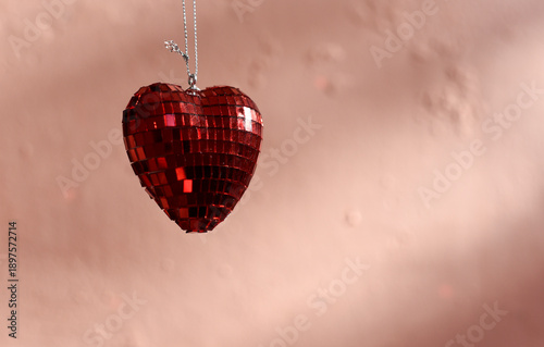 Hearts on peach color background, St. Valentines Day holiday 