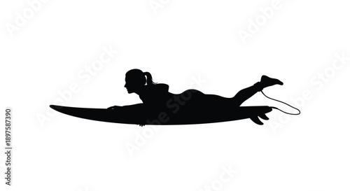 A person lying on a surfboard enjoying the waves silhouette