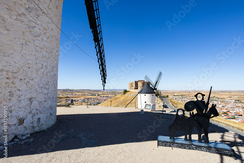 Don Quixote silhouette and historic windmills in Consuegra, Spain