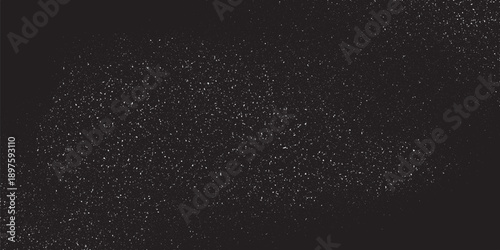 Abstract starry night sky background with white stipple grain texture on black.