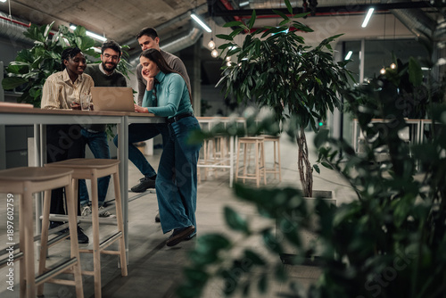 Quadro em tela Diverse business team collaborating using laptop in modern office