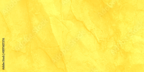 Vintage yellow parchment texture with a grungy aged finish and stained antique patterns creates a blank retro backdrop for a dirty brown paper design