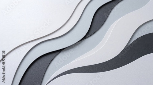 Abstract flowing waves of paper in shades of gray and white create a modern minimalist background