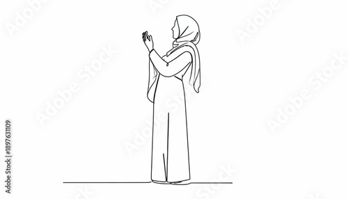 Woman in traditional Islamic clothing using a smartphone.