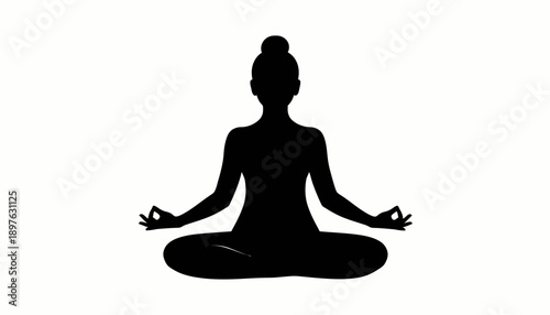 Woman meditating in lotus position silhouette.