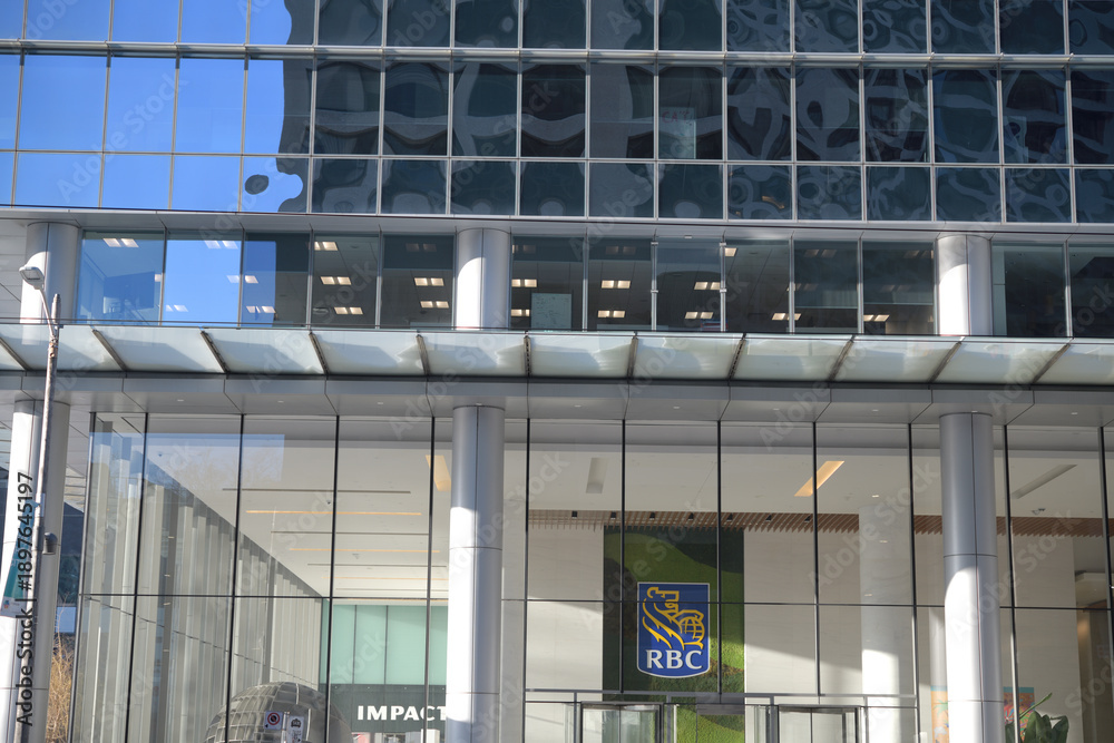 Fototapeta premium near street level view of RBC WaterPark Place with corporate logo located at 88 Queens Quay W, Toronto