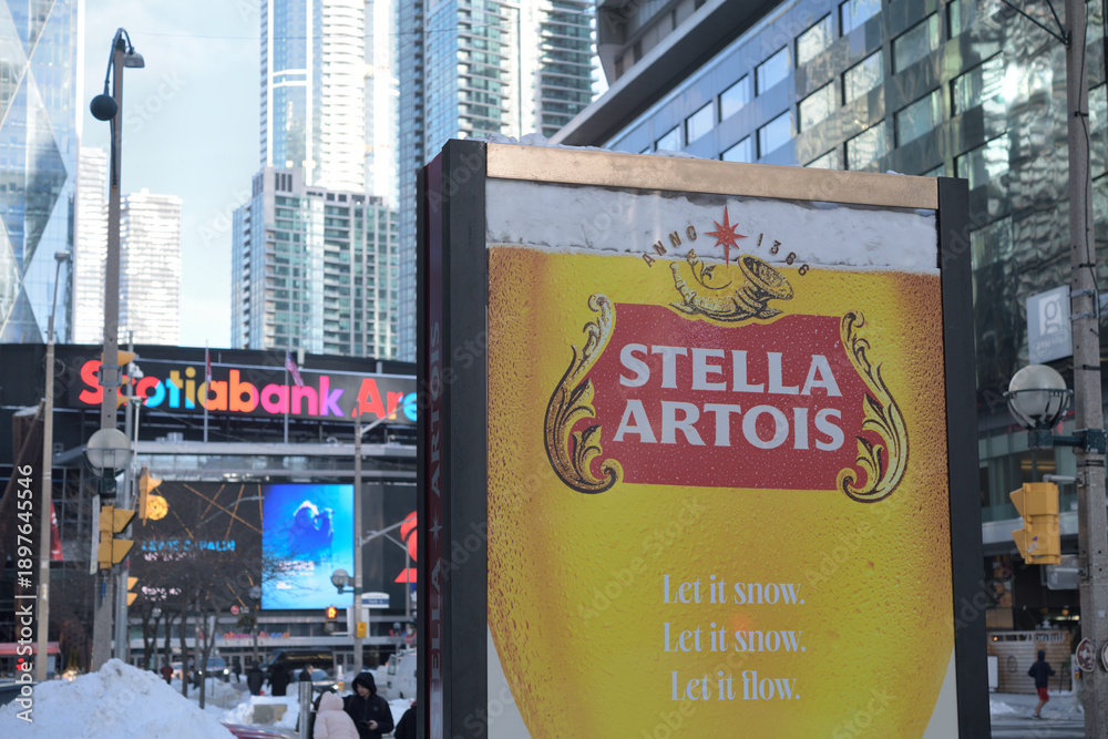 Fototapeta premium street advertisement for beer on Bremner Blvd (with view of Scotiabank Arena), Toronto
