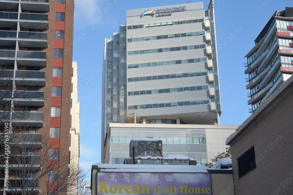 Naklejka premium Korean Grill House (214 Queen St W) and Mackenzie Investments, Canada Life Campus (180 Simcoe St) viewed from Renfrew Pl, Toronto