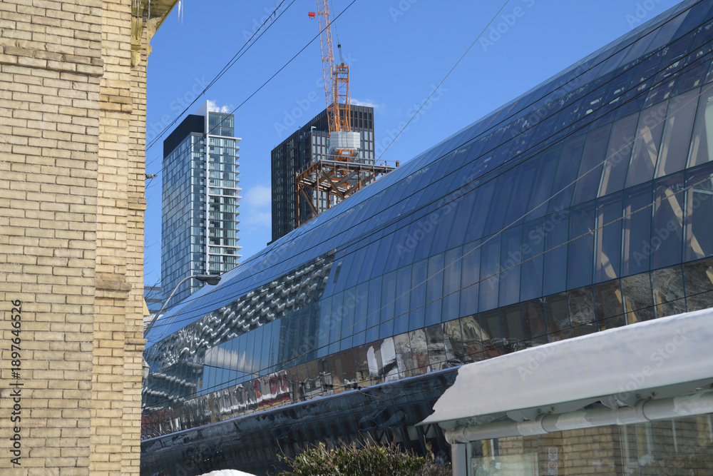 Fototapeta premium historic yellow brick wall and sleep Galleria Italia canopy designed by Frank Gehry at the Art Gallery of Ontario, Toronto