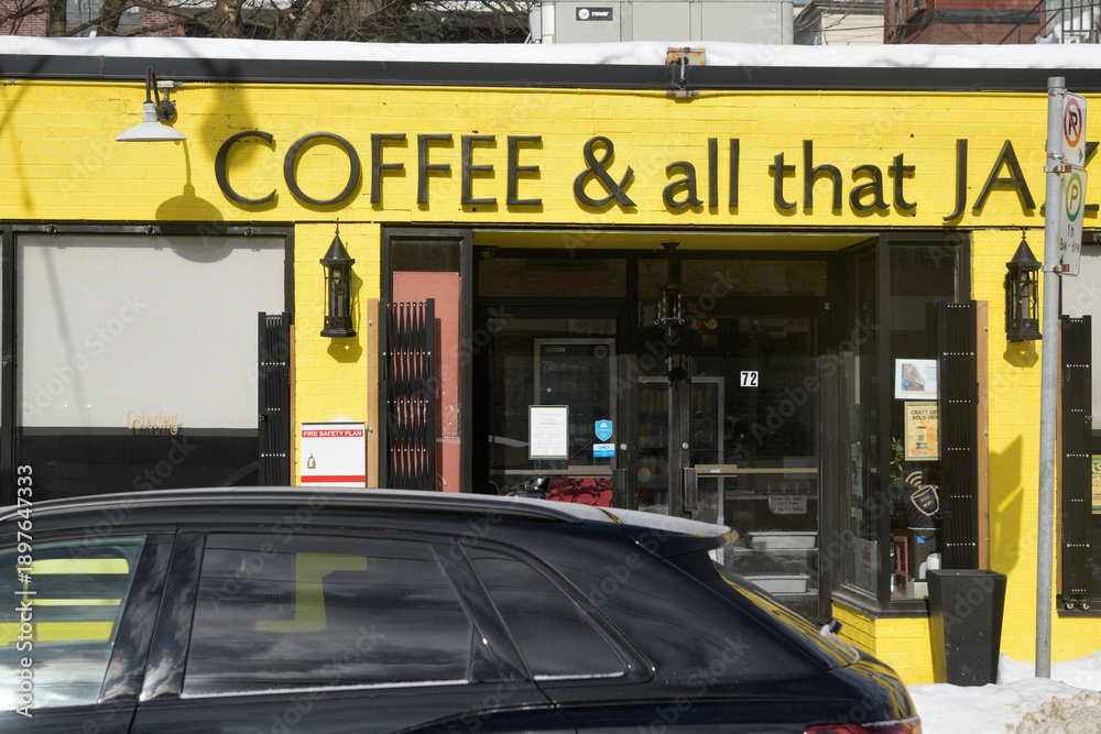 Fototapeta premium exterior building facade and sign of Coffee & All That Jazz, a cafe, located at 72 Howard Park Av, Toronto