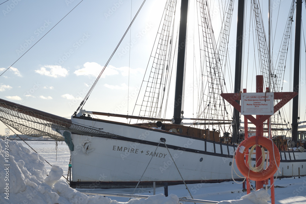 Naklejka premium The Empire Sandy, a large passenger sailing ship, moored in Toronto Harbor in winter